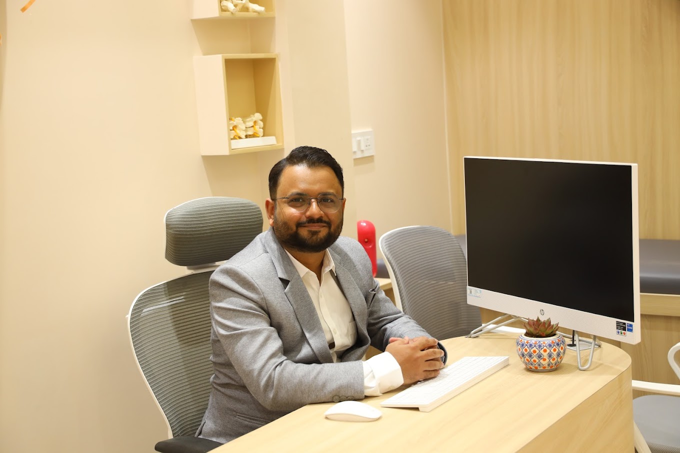 Dr Vatsal Parmar seated in consultation room